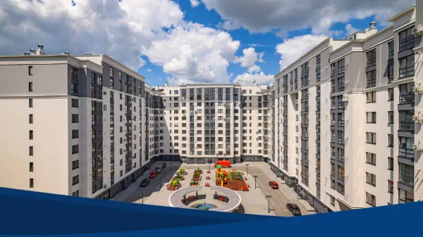 Fotografía de una zona de edificios con departamentos nuevos en color blanco